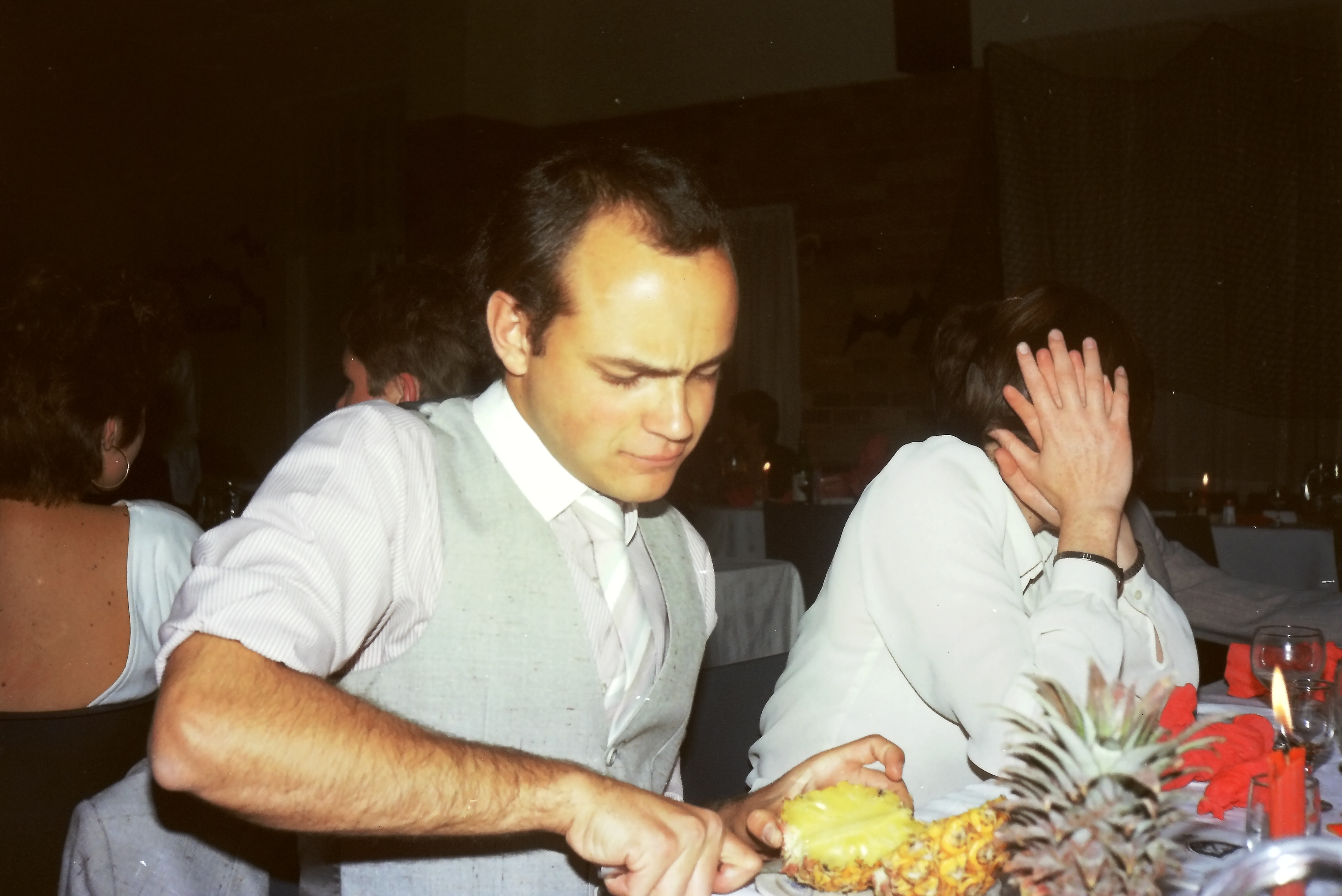 Andre cutting a pineapple