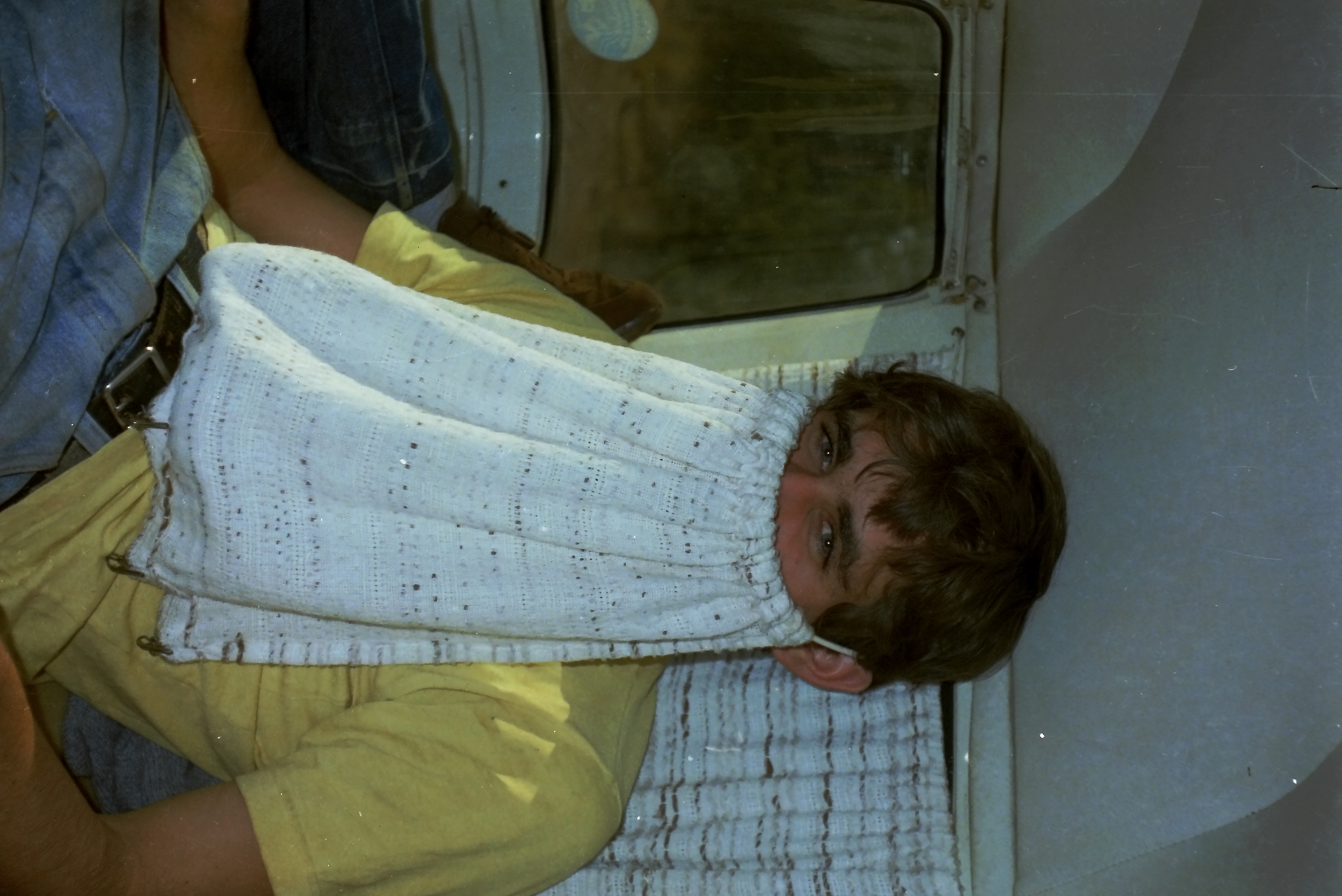 Michael playing with minibus curtains